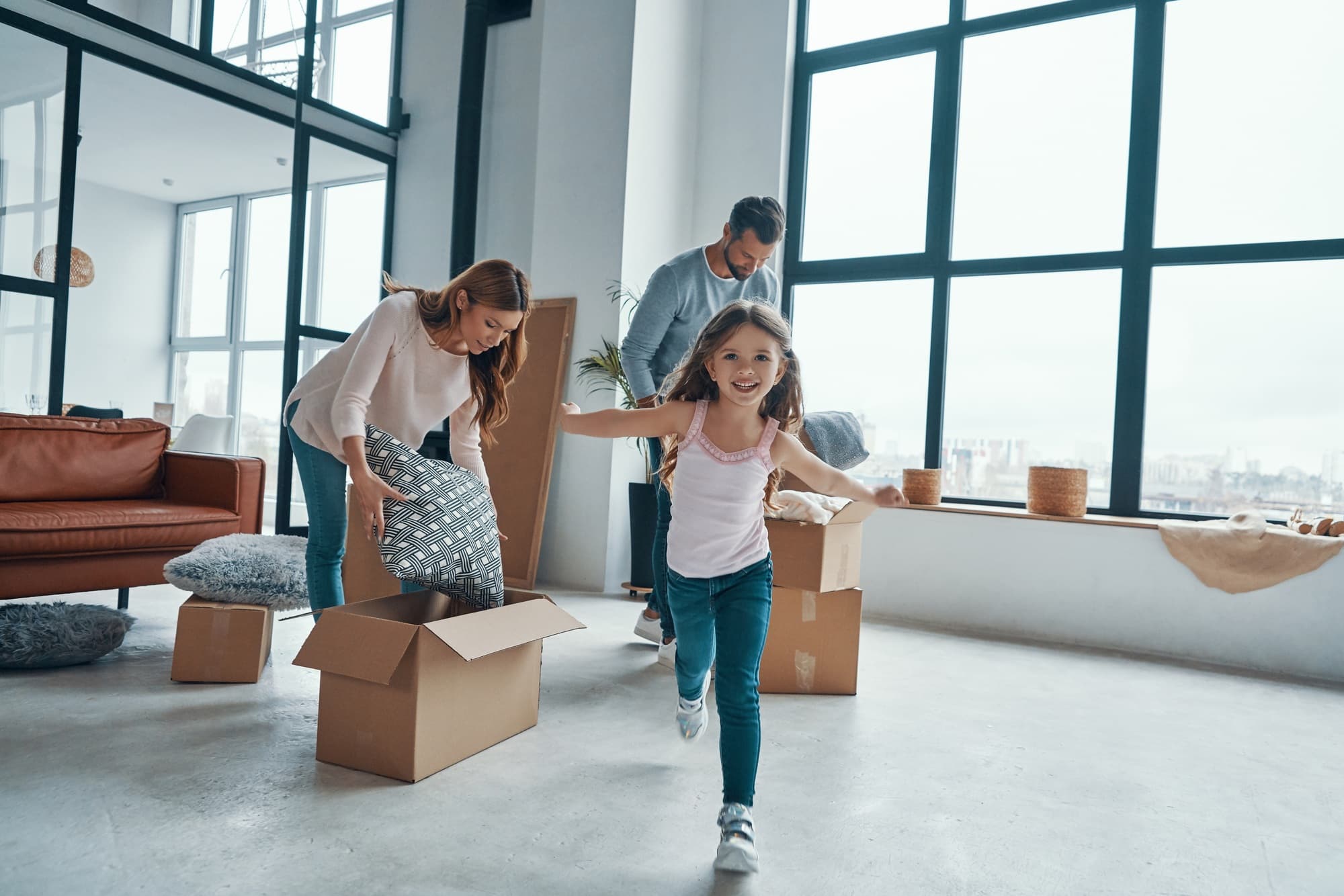 Happy family moving into their new home
