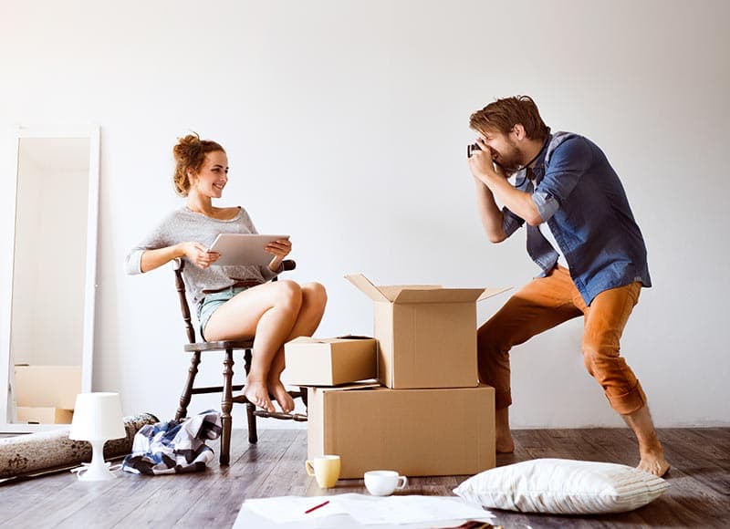 Happy couple moving into new home